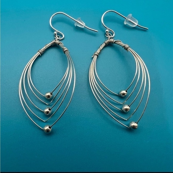 Multi Hoops with moving silver balls dangle earrings. - Picture 6 of 12